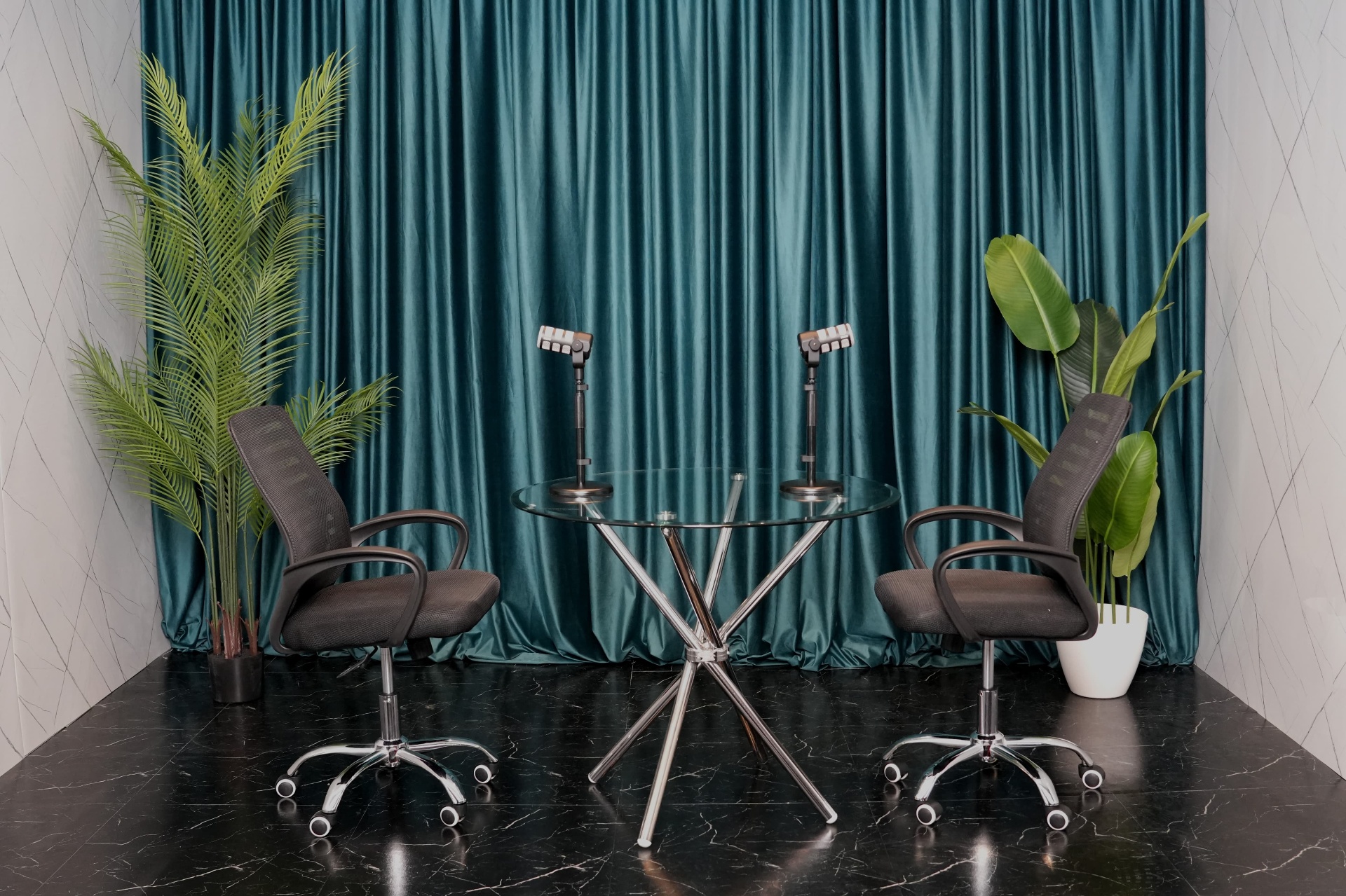 Professional podcast setup with teal curtains